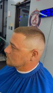 Side profile of a client with a short crew cut and a smooth skin fade